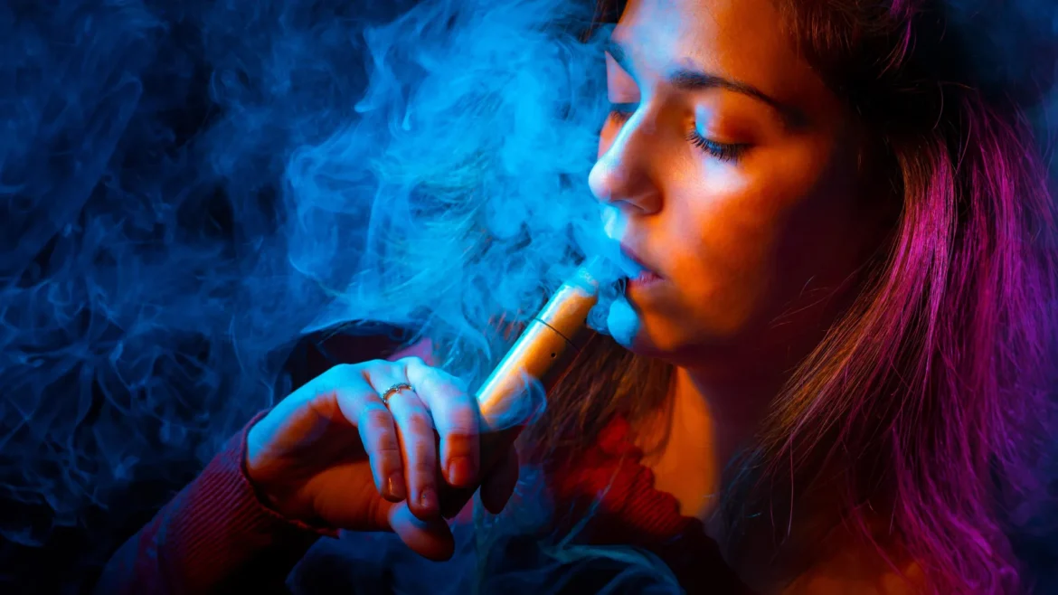 Woman vaping electronic cigarette girl